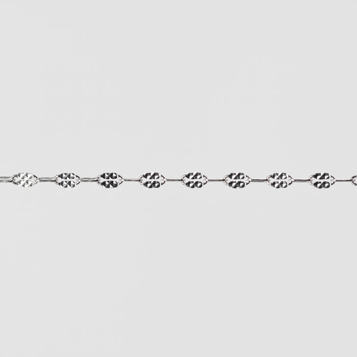 Silver chain on a light gray background