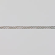 Silver chain on a light gray background