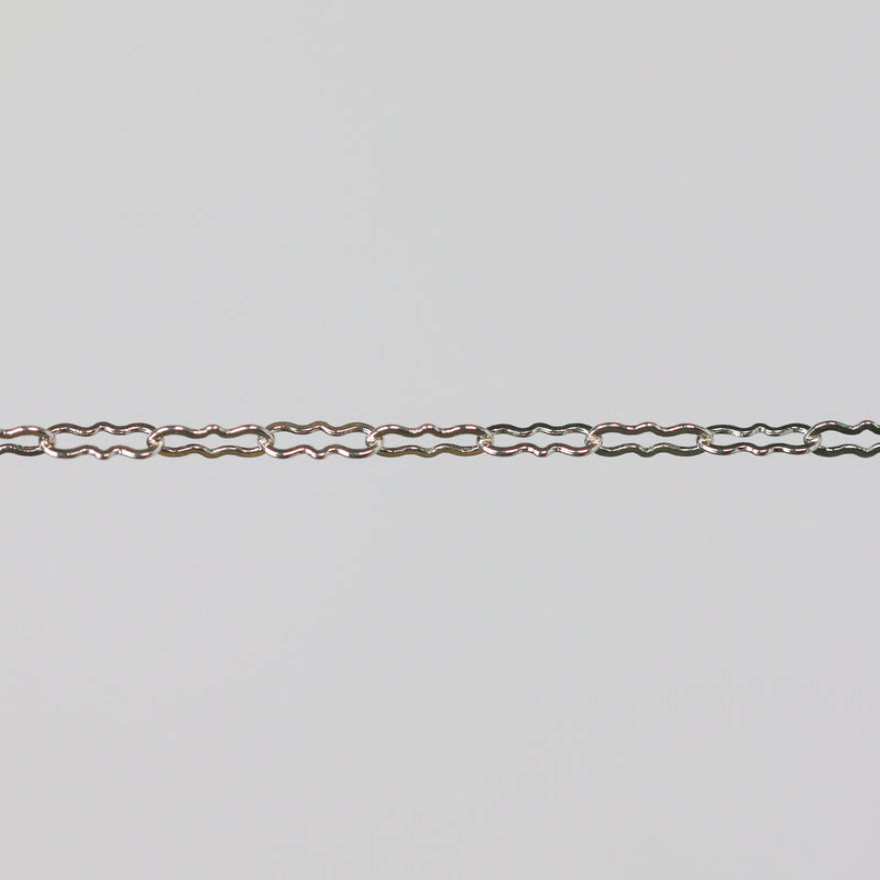 Silver chain on a light gray background