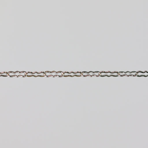 Silver chain on a light gray background