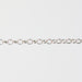 Silver chain for permanent jewelry making on a gray background