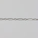 Sterling silver permanent jewelry chain on a gray background