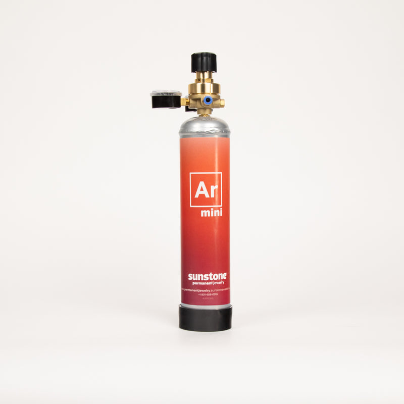 Sunstone Argon mini gas canister with a mini gas regulator on a white background