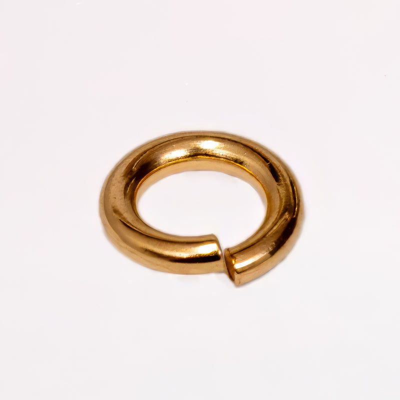14K Yellow Gold metal jump ring, shown on a plain white background.