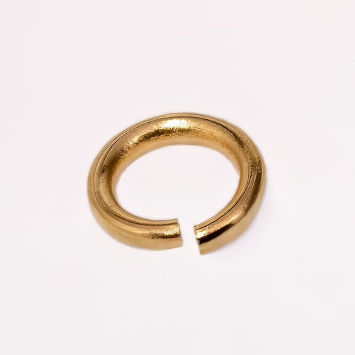 A gold filled yellow metal jump ring, photographed on a clean white background.