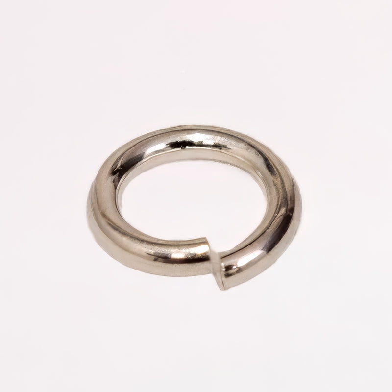 Sterling silver metal jump ring for permanent jewelry, shown on a plain white background.