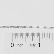 Silver chain with a ruler for scale on a white background