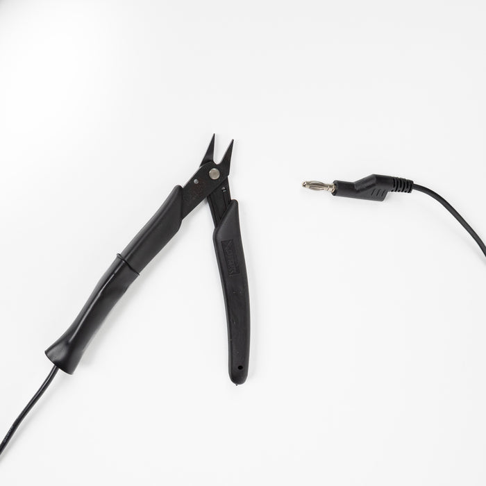 Black pliers for precision and grounding jewelry workpieces on permanent jewelry welders