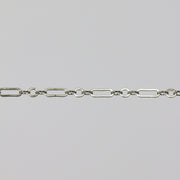 White gold cable chain with paperclip links on a gray background