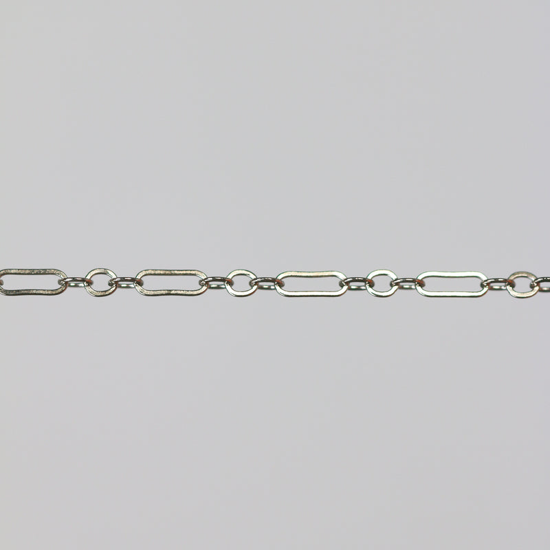 White gold cable chain with paperclip links on a gray background