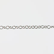 Round permanent jewelry chain on a light gray background