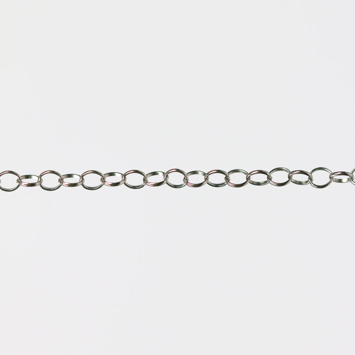 Round permanent jewelry chain on a light gray background