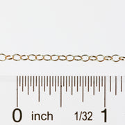 The Lucy chain being measured by a ruler to show that the chain can be purchased in bulk quantities