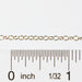 The Lucy chain being measured by a ruler to show that the chain can be purchased in bulk quantities