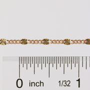 A gold wholesale chain shown as being available to buy by the inch.