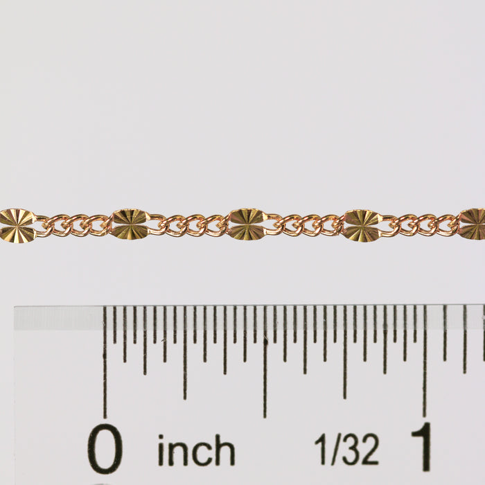 A gold wholesale chain shown as being available to buy by the inch.