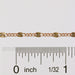 A gold wholesale chain shown as being available to buy by the inch.