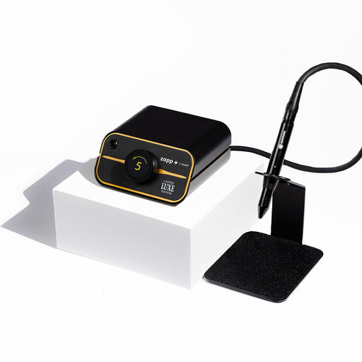 PJ Welder with gold accents, black casing, and a black welding stylus