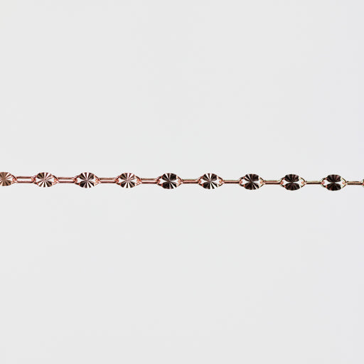 Rose gold bracelet on a light gray background