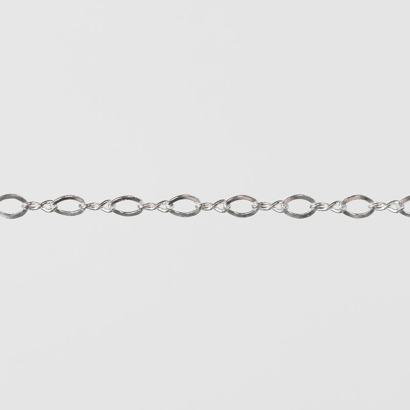 Twisty Silver chain on a gray background.