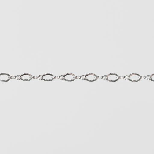 Twisty Silver chain on a gray background.