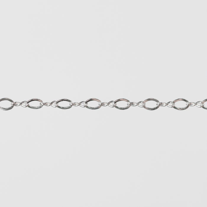 Twisty Silver chain on a gray background.